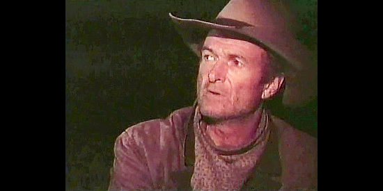 Michael Greene as Mike Berry, one of Matt's witnesses, wary of sounds in the night in Gunsmoke, The Long Ride (1993)