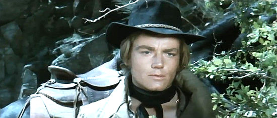 Peter Lee Lawrence as Robert MacGregor, wondering who he can trust in More Dollars for the MacGregors (1970)
