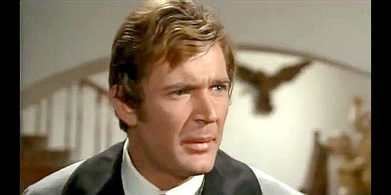 Rino Sentieri (William Reed) as Charles Prescott, questioning the cruelty to the peons in Pray to God and Dig Your Grave (1968)