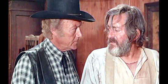 Andres Mejuto as Sheriff Sullivan and Eduardo Calvo as Doc Dempsey discuss a mysterious death in Prey of the Vultures (1972)