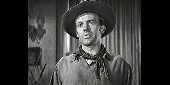 Arthur Kennedy as Jim Younger, eager to get in touch with Mary in Bad Men of Missouri (1941)