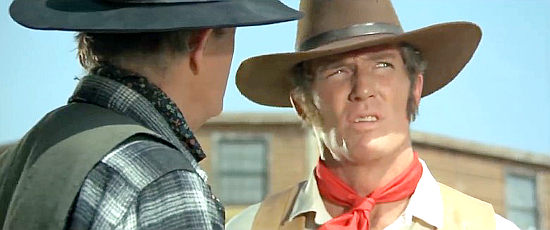 Brad Harris as Django, contemplating a coming showdown with Scott Miller in Death is Sweet from the Soldier of God (1972)