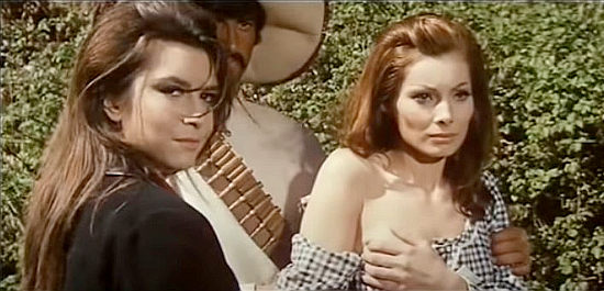 Daniela Giordano as Paquita begins to strip Lara (Luisa Baratto as Liz Barrett) for her men's enjoyment in Long Day of the Massacre (1968)