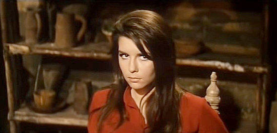 Daniela Giordano as Paquita, wary of Clay's focus on her legs rather than his banditry in Long Day of the Massacre (1968)