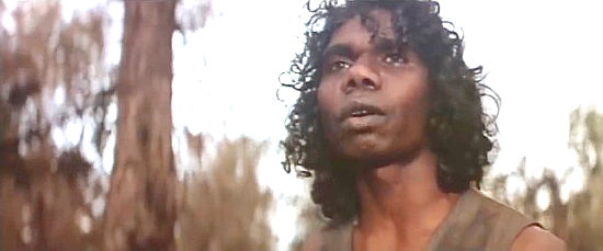 David Gulpilil as Billy, the aborigine who saves, then befriends Morgan in Mad Dog Morgan (1975)