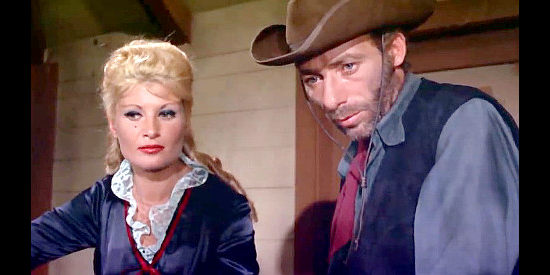 Dina De Santis (Dyna De Saint) as saloon singer Nora with Jake (Luigi Ciavarra), one of Morrison's henchmen in Three Lead Dollars (1964),