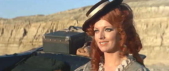 Gisella Arden (Kim Arden) as saloon owner Katy, who reached Three Crosses and finds a surprise in I'll Die for Vengeance (1968)