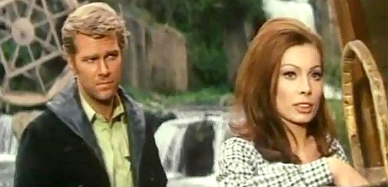 Glenn Saxson as Evans, the new sheriff quizzing Lara about the whereabouts of the former sheriff in Long Day of the Massacre (1968)