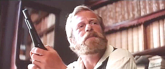 Jack Thompson as Detective Manwaring, preparing to go on the hunt for Morgan in Mad Dog Morgan (1975)