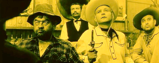 Josep Hlinomaz as Gunslinger Grimpo has his first encounter with Lemonade Joe (Karel Fiala) in Lemonade Joe (1964)