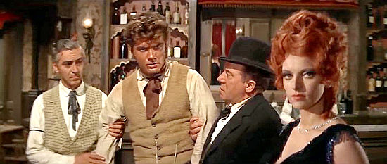 Kirk Morris as Jeff Smart (second from right) and Gisella Aren as Katy after a barroom brawl in I'll Die for Vengeance (1968)