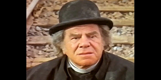 Lionel Stander as Sam, tied to the tracks and hoping the train engineer is a Godly man in Hallelujah at Vera Cruz (1973)