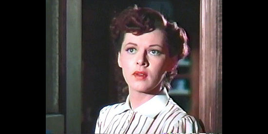 Lorna Gray as Molly Bannister, fretting about her boyfriend's future in Brimstone (1949)