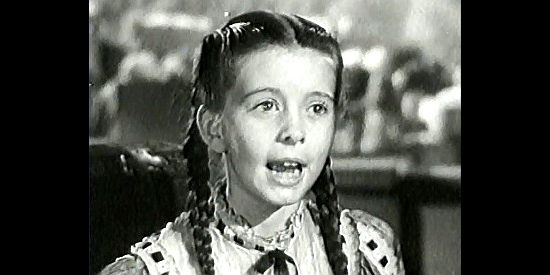 Margaret O'Brien as Emmy, the young girl who worms her way into Bad Bascomb's cold heart in Bad Bascomb (1946)