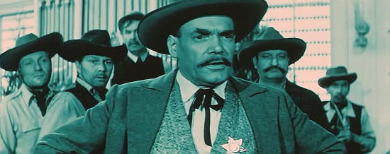 Oldirch Lukes as the sheriff, encountering Hogofogo in the Trigger Whiskey Saloon in Lemonade Joe (1964)
