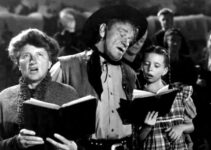 Marjorie Main as Abbey Hanks, Wallace Beery as Bad Bascomb and Margaret O'Brien as Emmy, signing hymns in Bad Bascomb (1946)