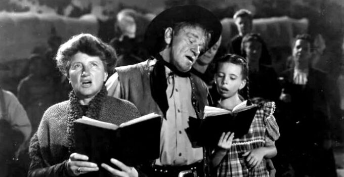 Marjorie Main as Abbey Hanks, Wallace Beery as Bad Bascomb and Margaret O'Brien as Emmy, signing hymns in Bad Bascomb (1946)