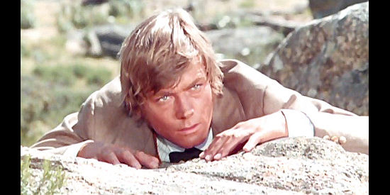 Peter Lee Lawrence as Danny O'Hara, spotting clues during a stage holdup in Prey of the Vultures (1972)