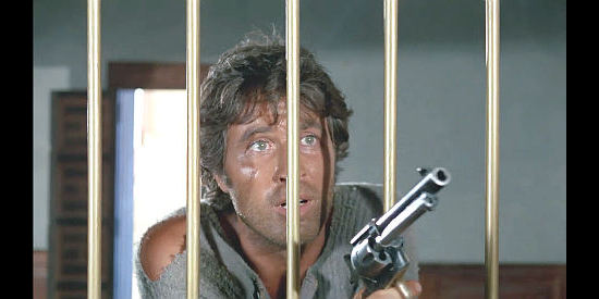 Peter Martell as Pot, using some six-gun persuasion to withdraw money from a bank account that doesn't exist in His Name was Pot … But They Called Him Allegria (1971)