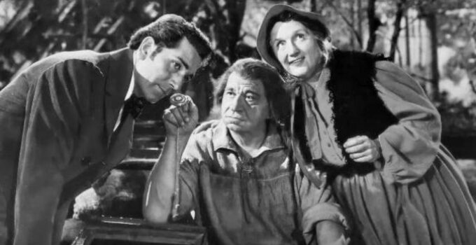 Richard Conte as Dr. Alexander Meade listens to a watch Big Jack Horner (Wallace Beery) has 'collected' while Marjorie Main (Flapjack Kate) listens too in Big Jack (1949)