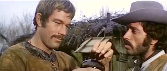 Richard Harrison as Joe Dakota and Roberto Maldere as Ted Browne discuss snakes of the repitle and human variety in Shoot Joe and Shoot Again (1971)