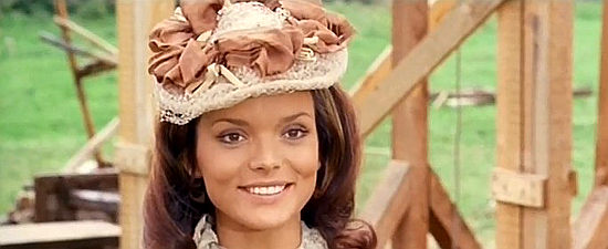 Uschi Glas as Mrs. Gibbons, smiling because things are looking up in Moonville in Hallelujah and Sartana Strike Again (1972)