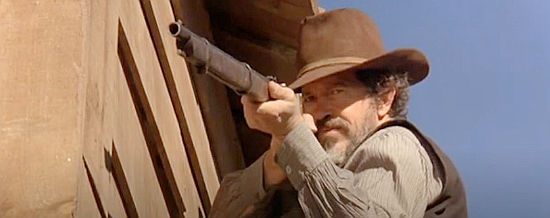 Warren Oates as Matthew Sebanek, ordering a stranger off his land in China 9, Liberty 37 (1978)