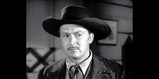 Albert Dekker as Brit Dawson, suspicious of Lacey's reason for entering a partnership with Craig in In Old California (1942)