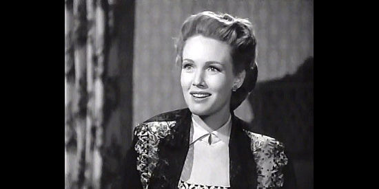 Barbara Britton as Cynthy Walters, not believing Bob's plans to join her show in I Shot Jesse James (1949)