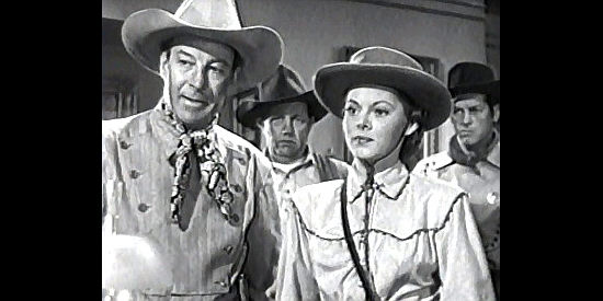 Bill Elliott as Gary Conway and Lorna Gray (Adrian Booth) as Connie Faulkner, confronting her uncle about editing her dispatches in The Gallant Legion (1948)