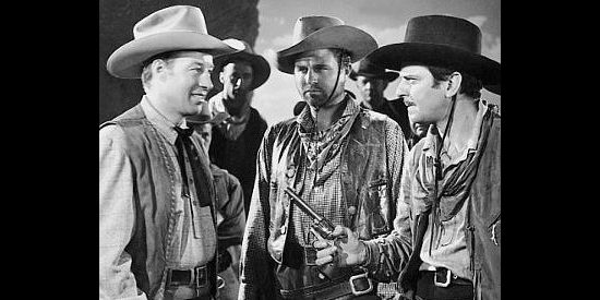 Bill Elliott as Jim McWade in a tense moment with friend John Wesley Barker (John Carroll) in The Fabulous Texan (1947)