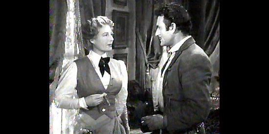 Binnie Barnes as Kiki Kelly and Gilbert Roland as Pecos Kid discuss Liza's map in The Dude Goes West (1948)