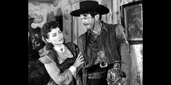 Catherine McLeod as Alice Sharp tries to help a wounded John Wesley Barker (John Carroll) in The Fabulous Texan (1947)