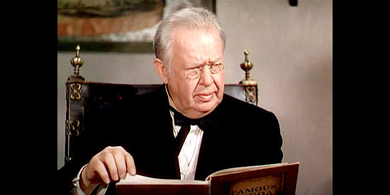 Charles Coburn as Gen. O'Hara, checking his book of opera singers and wondering by Lillian doesn't fit the mold in The Gal Who Took the West (1949)