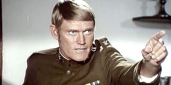 Chuck Connors as Col. Wilcox, ordering an assault on a fly in Pancho Villa (1972)