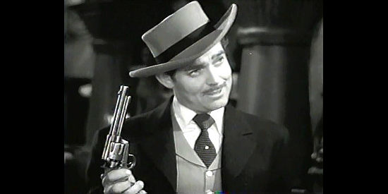 Clark Gable as Candy Johnson, challenging his rival to a game of Russian roulette in Honky Tonk (1941)