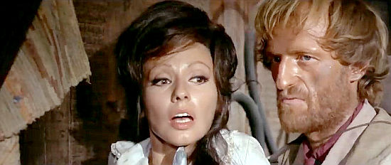 Claudie Lange as Annie, threatened by Gary (Bruno Corazzari) when John Forest refuses to talk in Vengeance is Mine (1967)