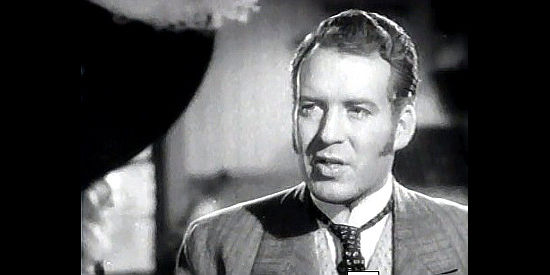 Dick Foran as Wayne Carter, the newspaper editor who believes in the future of Greasewood City in My Little Chickadee (1940)