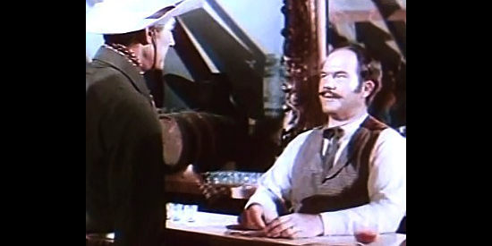 Dick Wessel as Bailey, confronted by Tom Andrews (Randolph Scott) in Canadian Pacific (1949)