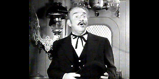 Edward Gargan as the train conductor in The Dude Goes West (1948)