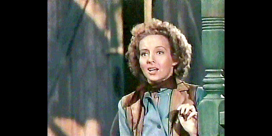 Evelyn Keyes as Allison McLeod, concerned as Cheyenne leads a stampede into town in The Desperadoes (1943)