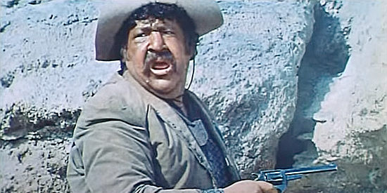 Fernando Sancho as Ramon Sartana, intervening to help an outlaw friend in Stagecoach of the Condemned (1970)