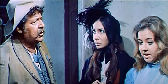 Fernando Sancho as Ramon Sartana questions Elizabeth Patrick (Elena Pironti) and her niece Joanna (Maria Cinta) in Stagecoach of the Condemned (1970)