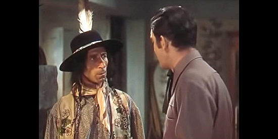 Frank Lackteen as Cherokee listens to Johnny's plans for raising Mary Ann in Frontier Gal (1945)