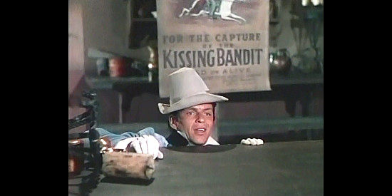 Frank Sinatra as Ricardo, making an awkward arrival at the inn his father used to run in The Kissing Bandit (1948)