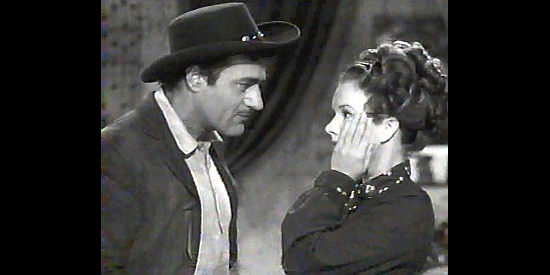 Gilbert Roland as Pecos Kid and Gale Storm as Liza Crockett in a disagreement over a map to a gold mine in The Dude Goes West (1948)