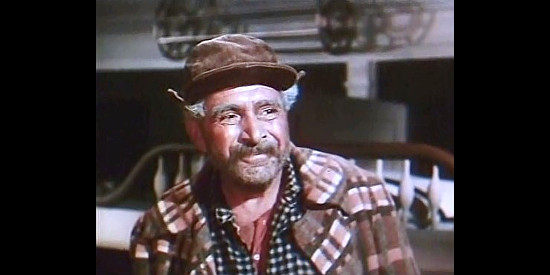 J. Carroll Naish as Dynamite Dawson, Tom Andrews' sidekick in Canadian Pacific (1949)