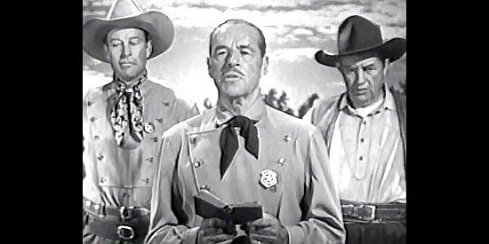 Jack Holt as Ranger Capt. Banner presiding over a funeral while flanked by Gary Conway (Bill Elliott) and Windy Hornblower (Andy Devine) in The Gallant Legion (1948)