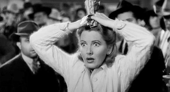 Jean Arthur as Molly J. Truesdale, reacting to her first drink of cactus milk in A Lady Takes a Chance (1943)