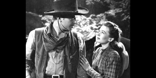 John Carroll as John Wesley Barker with Alice Sharp (Catherine McLeod), the woman he and his best friend love in The Fabulous Texan (1947)